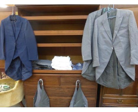 A selection of gentleman's morning wear including a navy morning coat with matching waistcoat and trousers; two grey morning 