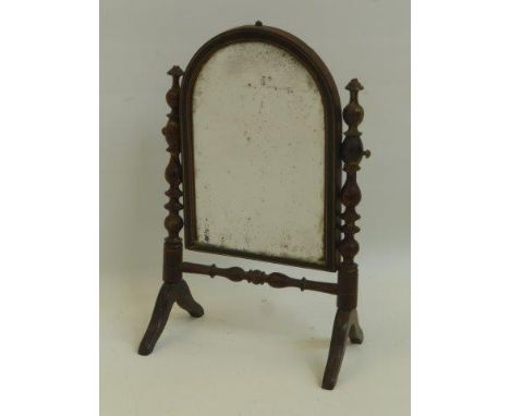 A Georgian inlaid mahogany oval topped dressing table mirror, raised on bobbin turned supports and stretcher.