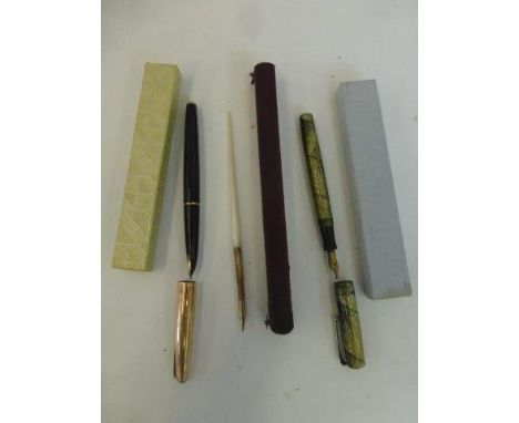 A Swan fountain pen, a rare Parker 61 insignia fountain pen with gold ribbed cap stamped Parker on one side with the Parker h