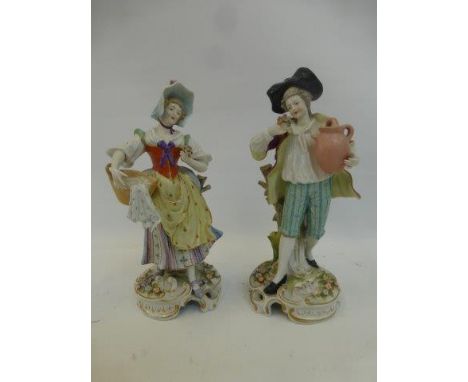 A pair of 19th Century German Sitzendorf ceramic figurines of a man and woman.