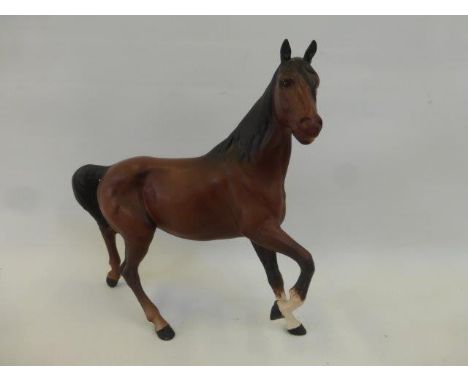 A Beswick brown mat prancing horse model No. 2688 designed by Graham Tongue.