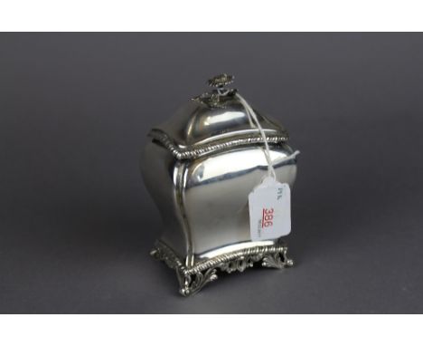 A late Victorian silver tea caddy, of waisted form with floral finial and gadrooning, 14cm high, Birmingham 1899, by Samuel W