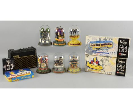 The Beatles six Franklin Mint hand crafted figurines with glass domes, three miniature guitars, two Beatles collection Corgi 