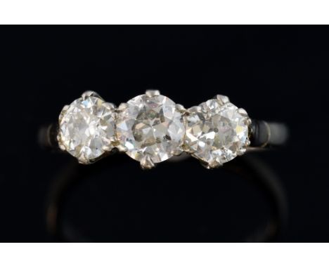 Three stone diamond ring, set with old cut stones, the central stone estimated at 0.50 and two stones of approximately 0.30, 