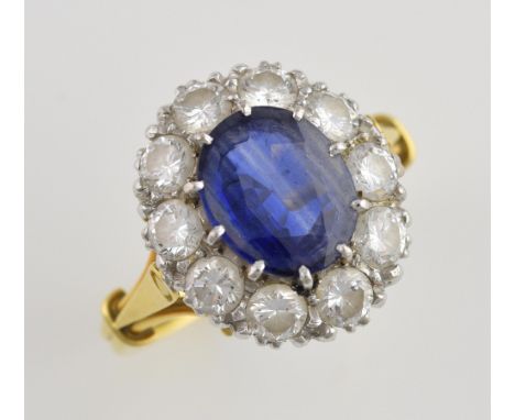  Vintage sapphire and diamond ring, set with an oval cut sapphire of good colour, estimated at 2.03 carat, within a border of