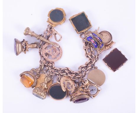 A 9ct rose gold double albert chain charm bracelet with fifteen charm attached mostly 9ct, one 15ct, some not hallmarked (not