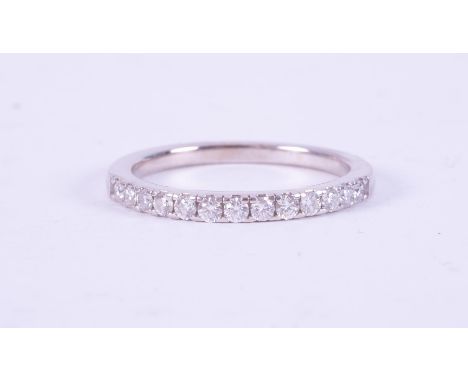 An 18ct white gold half eternity ring set with approx. 0.26 carats of round brilliant cut diamonds, (stones measured within t