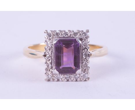 An 18ct yellow &amp; white gold ring set with a rectangular cut amethyst, approx. 1.17 carats, surrounded by small round cut 