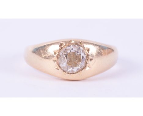 An antique 18ct yellow gold ring set with an old slightly off round cut diamond, approx. 0.71 carats, (measured within the re