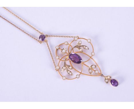 A 9ct yellow gold Art Nouveau design necklace set with two oval cut amethysts measuring 9mm x 5.5mm &amp; 5.5mm x 4mm and one