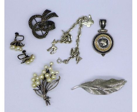 A silver bracelet, two silver brooches, a silver pendant, a pair of silver pearl earrings and a brooch, weight 56g