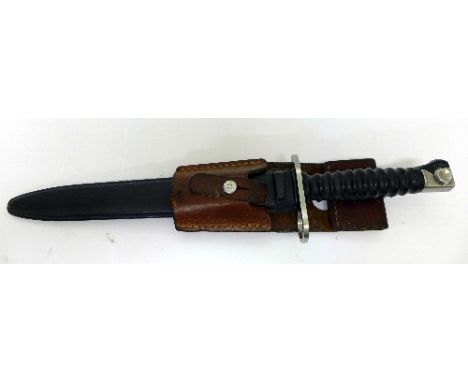 A bayonet with plastic scabbard, the blade marked V279846, with leather frog marked Imhof, 3900 Brig, 1988