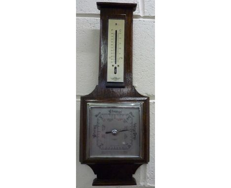 An oak barometer, thermometer a/f