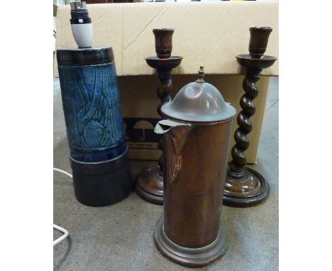 A Newlyn pottery lamp base, a copper coffee pot and a kettle, a pair of oak barleytwist candlesticks, a carved face mask, an 