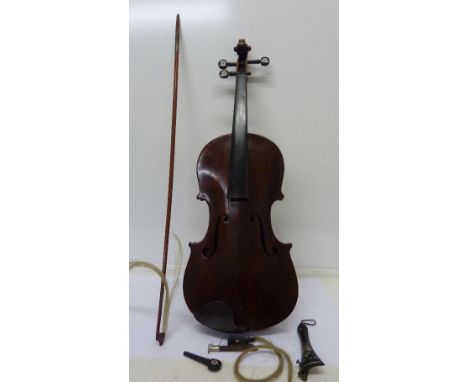 A cased violin and bow, a/f, with paper label, Joseph Guarnerius, length of back without button 36.5cm