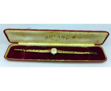 A lady's 9ct gold Rotary wristwatch on an integral 9ct gold strap, boxed