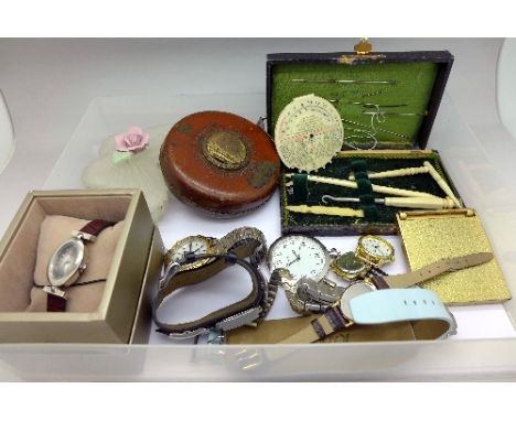 Wristwatches, a compact, a tape measure, trinket box, etc.