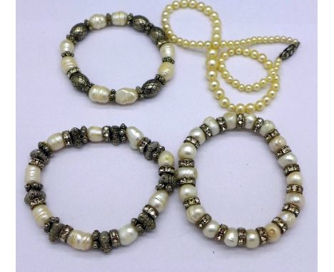 A cultured pearl necklace with silver clasp and three freshwater pearl bracelets