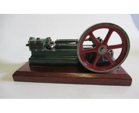 A horizontal signal cylinder mill engine finished in green/red, on wooden base, 8" x 2" x 4", G (Est. plus 21% premium inc. V