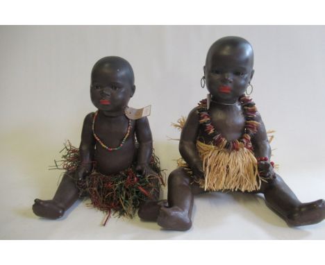 Two Heubach Koppelsdorf 399 mulatto bisque socket head dolls, both with brown glass sleeping eyes, closed mouths, pierced ear