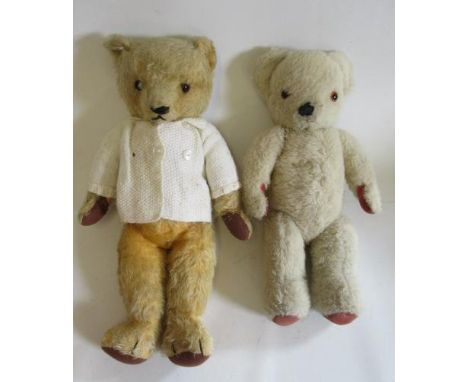 A pre-war Chad Valley teddy with amber eyes, cream cardigan, felt pads and sewn nose, 18 1/2", together with a 16 1/2" white 