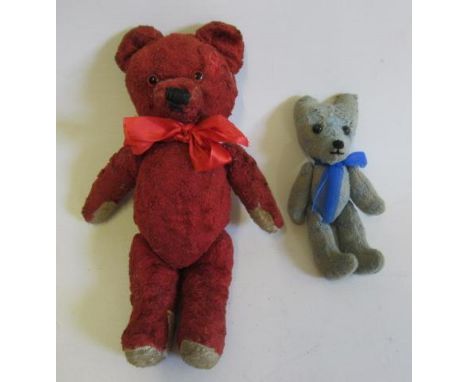 A rare Kiddicraft red teddy, with jointed hips and shoulders, red ribbon tie, label to foot and red eyes, 12" long, together 