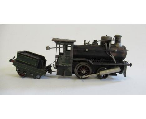 German 0-4-0 spirit fired steam engine and tender, no manufacturer's mark, stamped Made in Germany, paint loss on tender and 