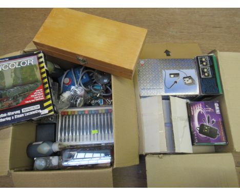 A quantity of railway paints model making tools including knife, set, soldering iron and battery charger (Est. plus 21% premi