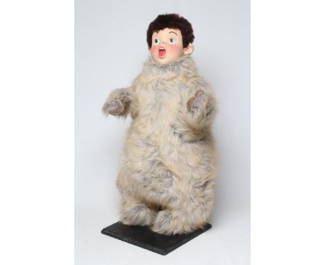 A shop display automaton modelled as a Lost Boy from Peter Pan, with rubber head, faux fur body and platform bearing maker's 