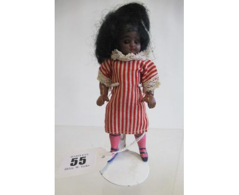 A possible Kammer &amp; Reinhardt bisque socket head dolls house mulatto doll, with brown glass sleeping eyes, open mouth, fi