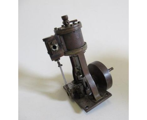 A single cylinder vertical steam engine, non-reversing, 1 3/4" cylinder and solid fly wheel, F (Est. plus 21% premium inc. VA