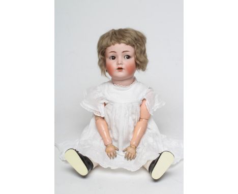 A Kammer &amp; Reinhardt bisque socket head flirty doll, with brown glass sideways glancing eyes, sleeping eyelids, open mout