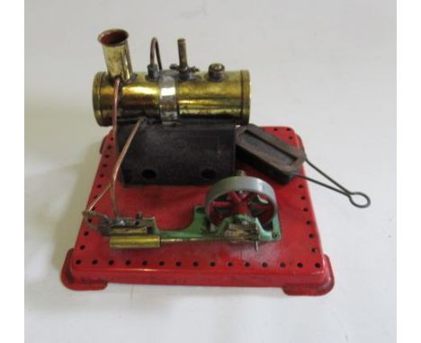 A Mamod spirit fired stationary steam engine with spirit burner, water level plug missing, F (Est. plus 21% premium inc. VAT)