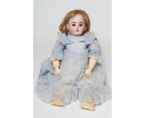 A Heinrich Handwerck bisque socket head doll, with blue glass fixed eyes, open mouth, teeth, pierced ears, auburn wig, wood a