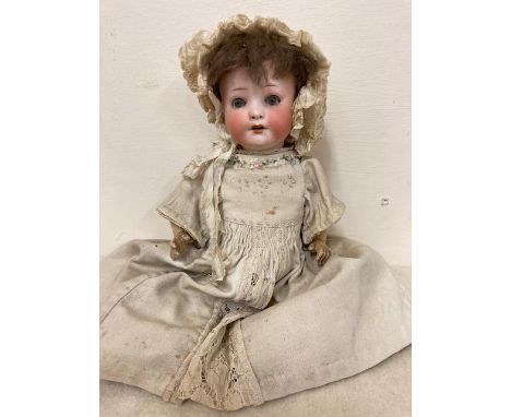 A Heubach Koppelsdorf bisque socket head doll, with blue glass sleeping eyes, open mouth, teeth, open nostrils, five piece co