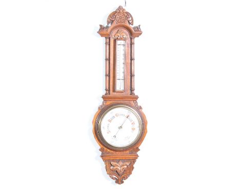 Victorian carved oak aneroid barometer and thermometer, 90cm.Condition report:Good condition. Slight rubbing to back. Baromet
