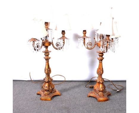 Pair of modern candelabra style table lamps, each with three scrolled branches and prismatic droplets, triangular base, heigh