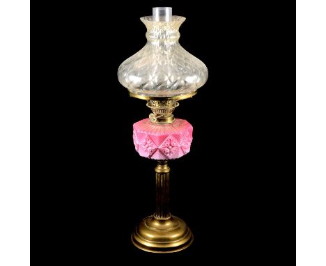 Victorian brass oil lamp, moulded glass reservoir, shade and chimney, 64cm.Condition report:There are nibbles to the top and 