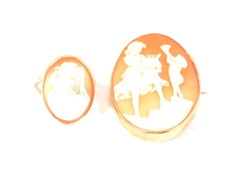 A cameo brooch, the oval carved shell cameo of a classical maiden and child playing musical instruments, 42x32mm, set in an u