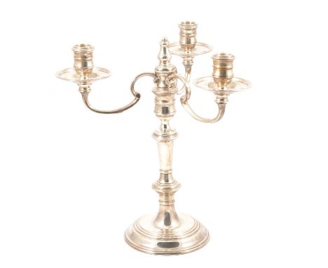 A silver three arm candelabra, Mappin &amp; Webb Ltd, London 1990, knopped stem, circular stepped foot, filled base, 32cm.