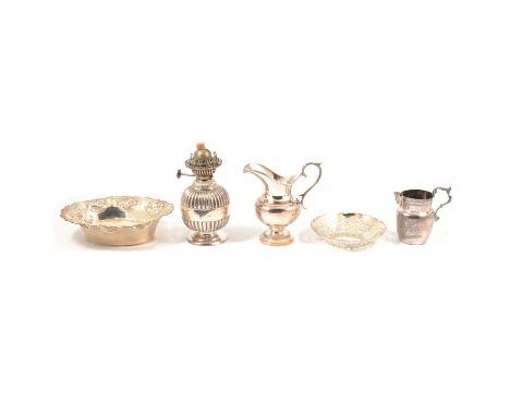 A silver bowl, floral decoration to pierced rim; a silver oil lamp, spherical form, with yellow glass shade; eight sets of ca