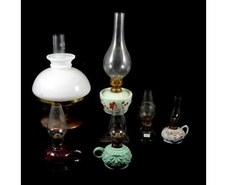 Copper oil lamp, complete with opaque shade and chimney, 41cm, another pedestal oil lamp with cast iron base, and four small 