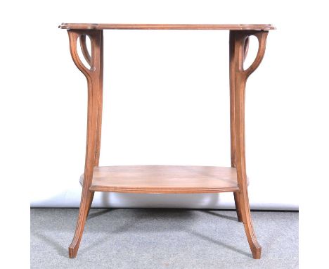 French Art Nouveau walnut occasional table, serpentine rectangular top, splayed legs joined by a shelf, the top 69x47cm, heig