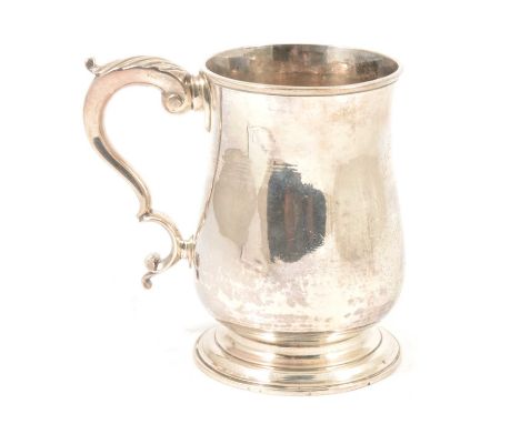 A silver tankard, WC, London 1783, plain polished finish with engraved floral cartouche and initials, double scroll handle wi