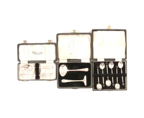 A child's silver pusher and spoon, Viner's Ltd, Sheffield 1946, boxed; a set of six silver coffee spoons, bean finials, boxed