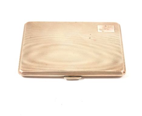A silver cigarette case, D Bros, Birmingham 1961, engine-turned, engraved initials, gilt interior, 11.5cm x 9cm.