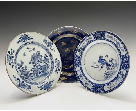 Three large Chinese porcelain plates, 18th century, one decorated with a bird perched on a stump, diameter 26.2cm.Provenance: