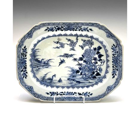 A Chinese Export porcelain octagonal blue and white meat dish, Qianlong Period (1736-1795), the river scene with a flowering 