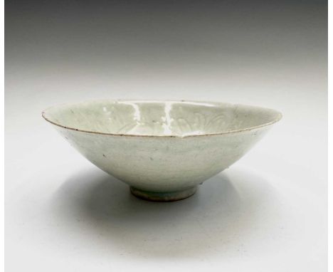 ??A Chinese Qingbai ware pale celadon tapering conical bowl, Song Dynasty, the interior with foliate decoration, height 7cm, 