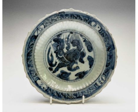 A Chinese blue and white dish, Ming Dynasty, depicting a Qilin to the centre and character marks in the border, scrolls to re